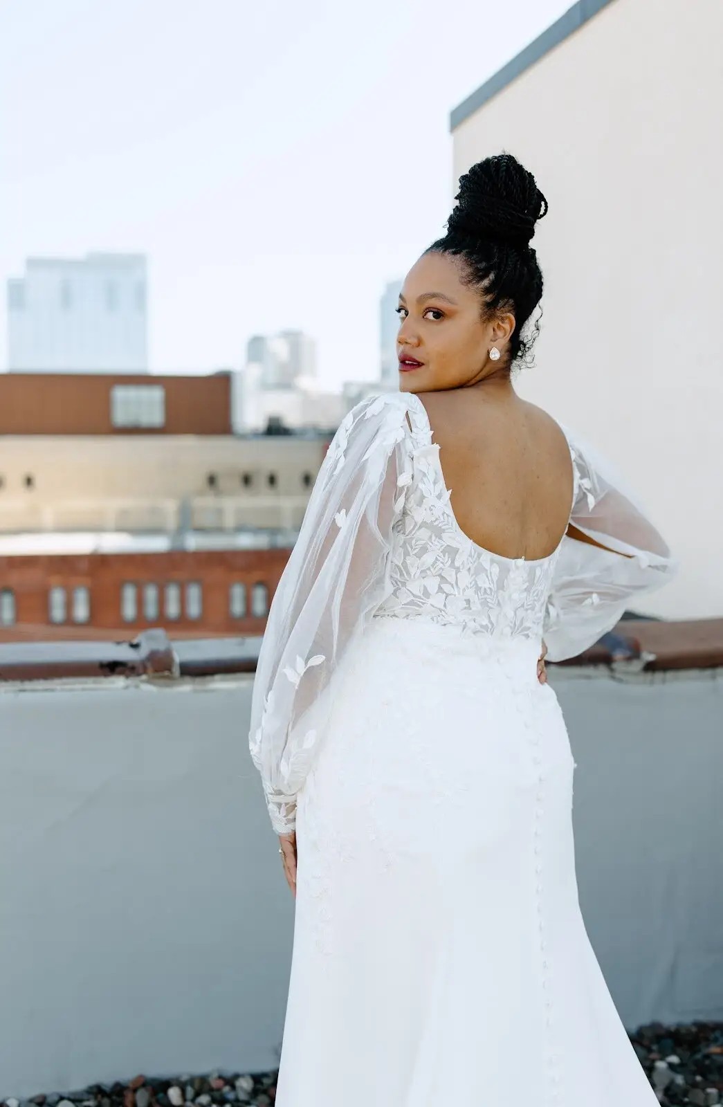 model wearing a floral wedding gown