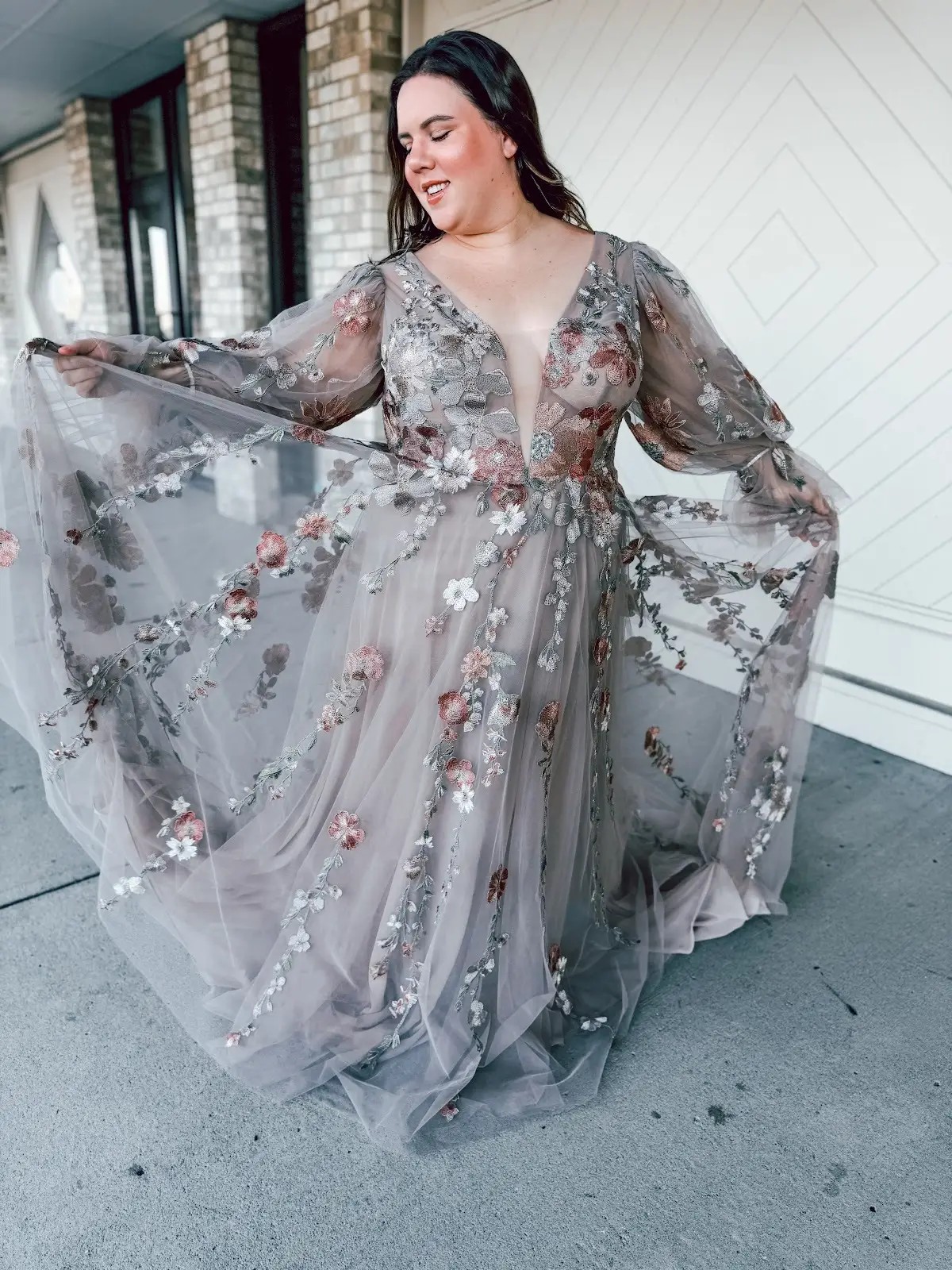 model wearing a floral wedding gown