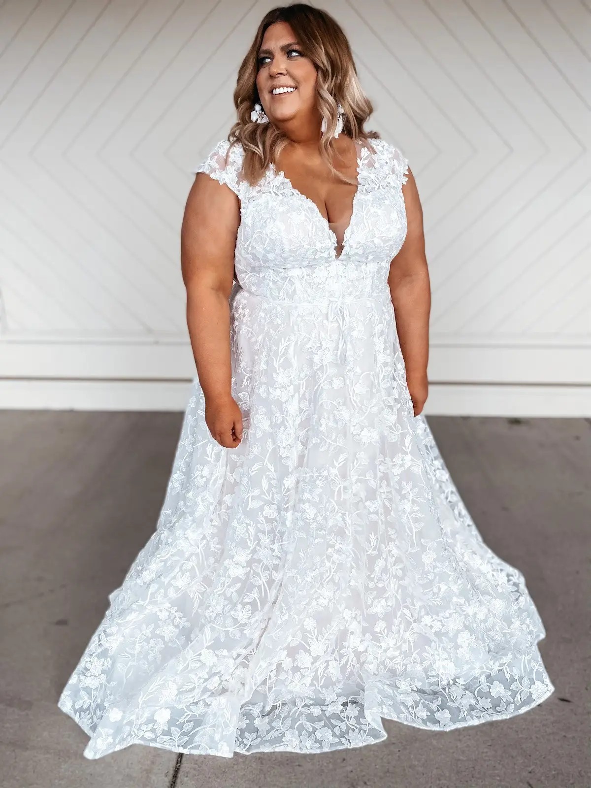 model wearing a floral wedding gown