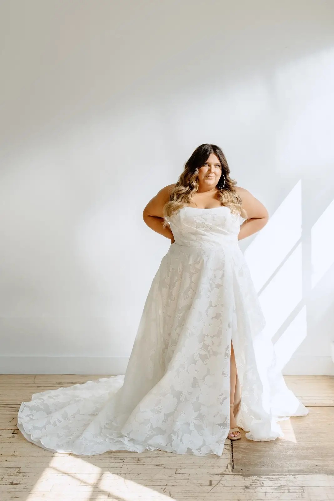 model wearing a floral wedding gown