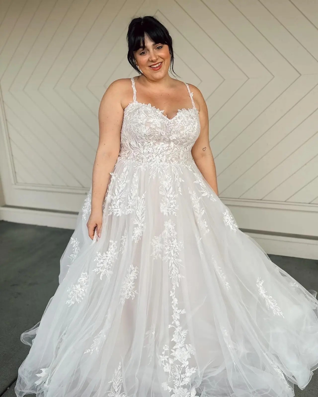 model wearing a floral wedding gown
