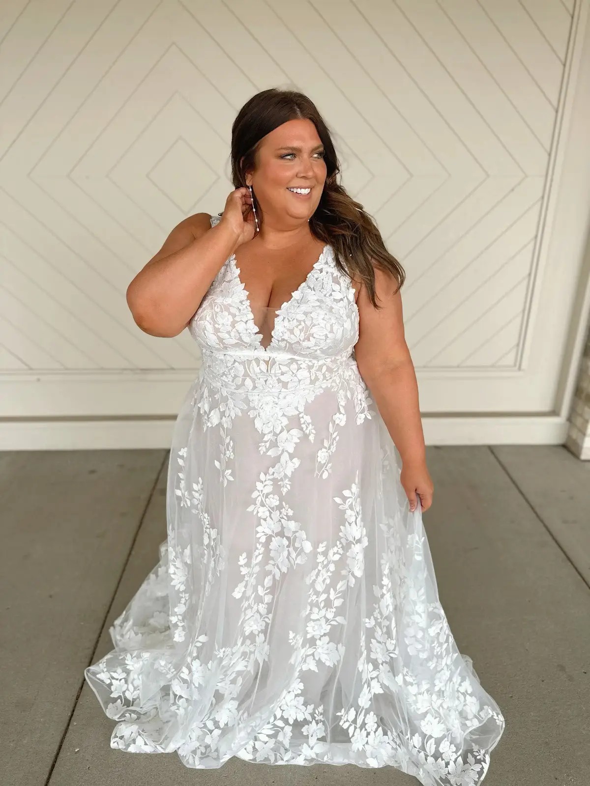 model wearing a floral wedding gown