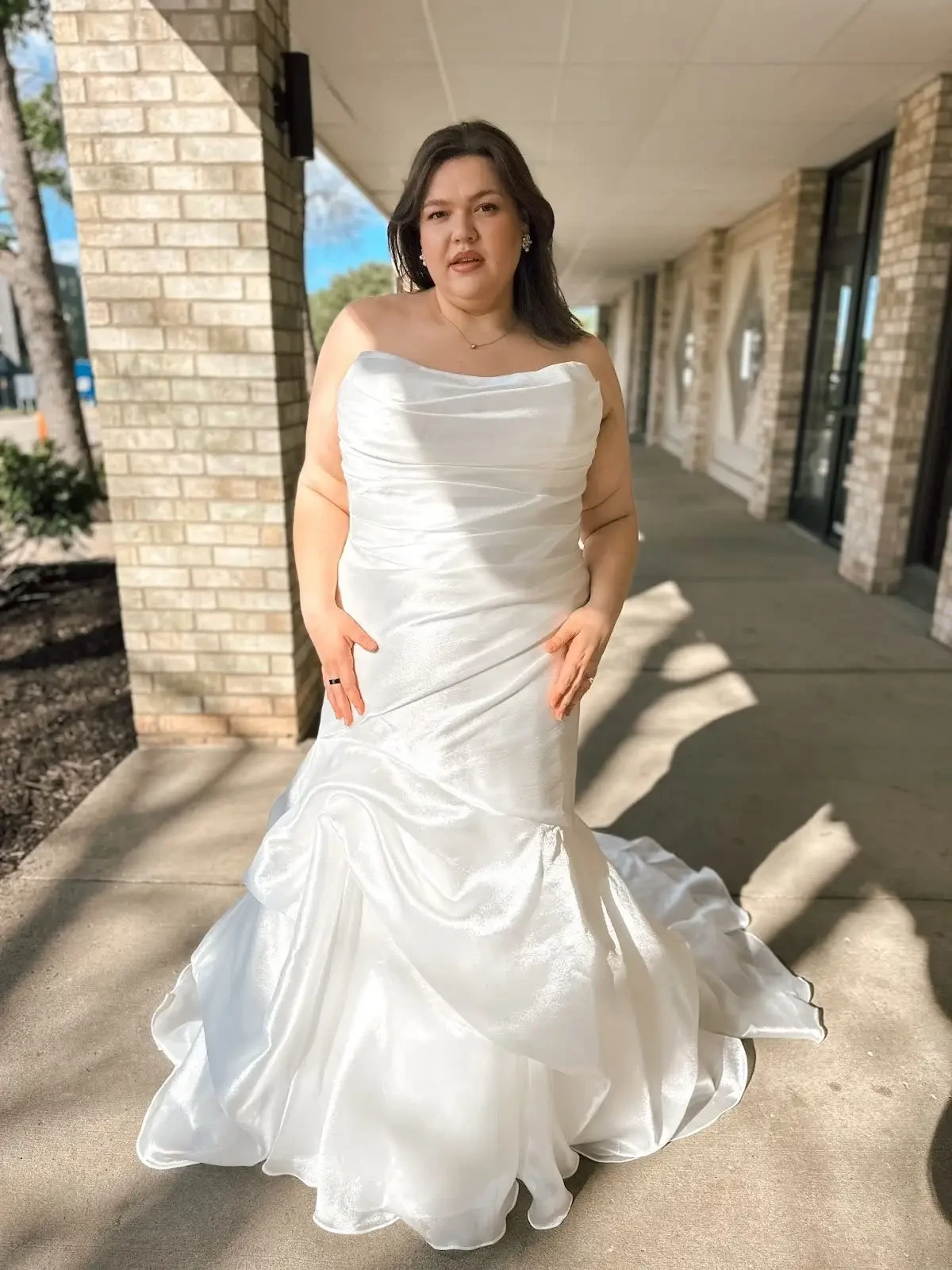 model wearing a fitted stella york wedding gown
