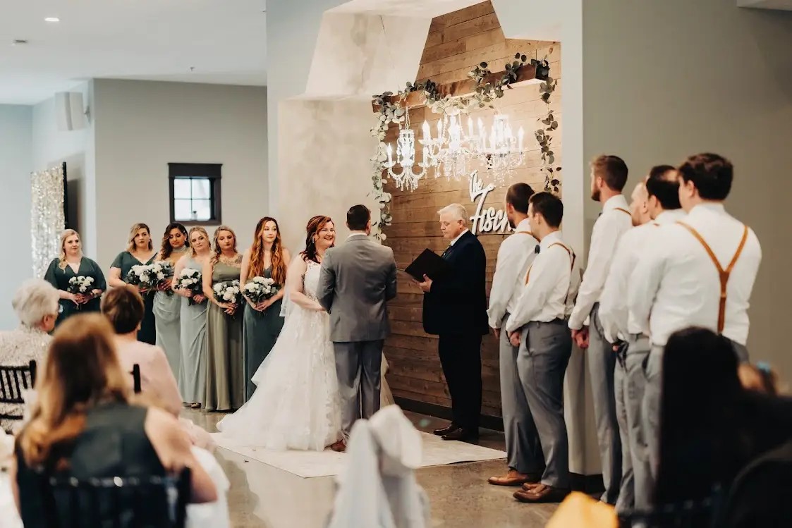 Luve Curvy Bridal Real Bride Bailey and groom Davis at the altar