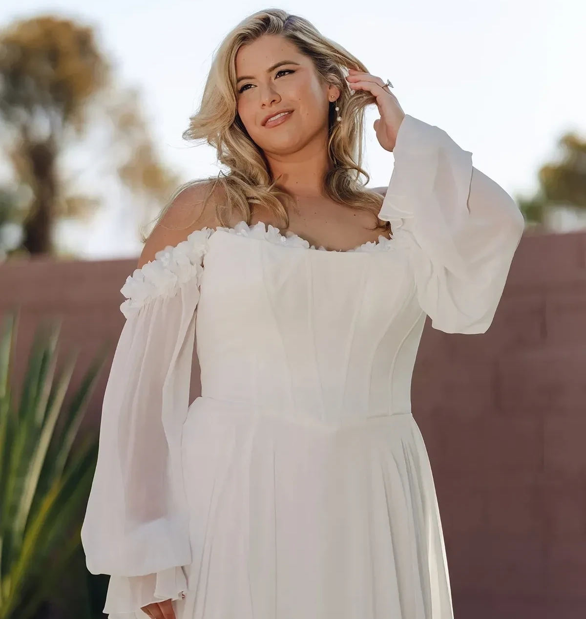 Model wearing a plus size gown