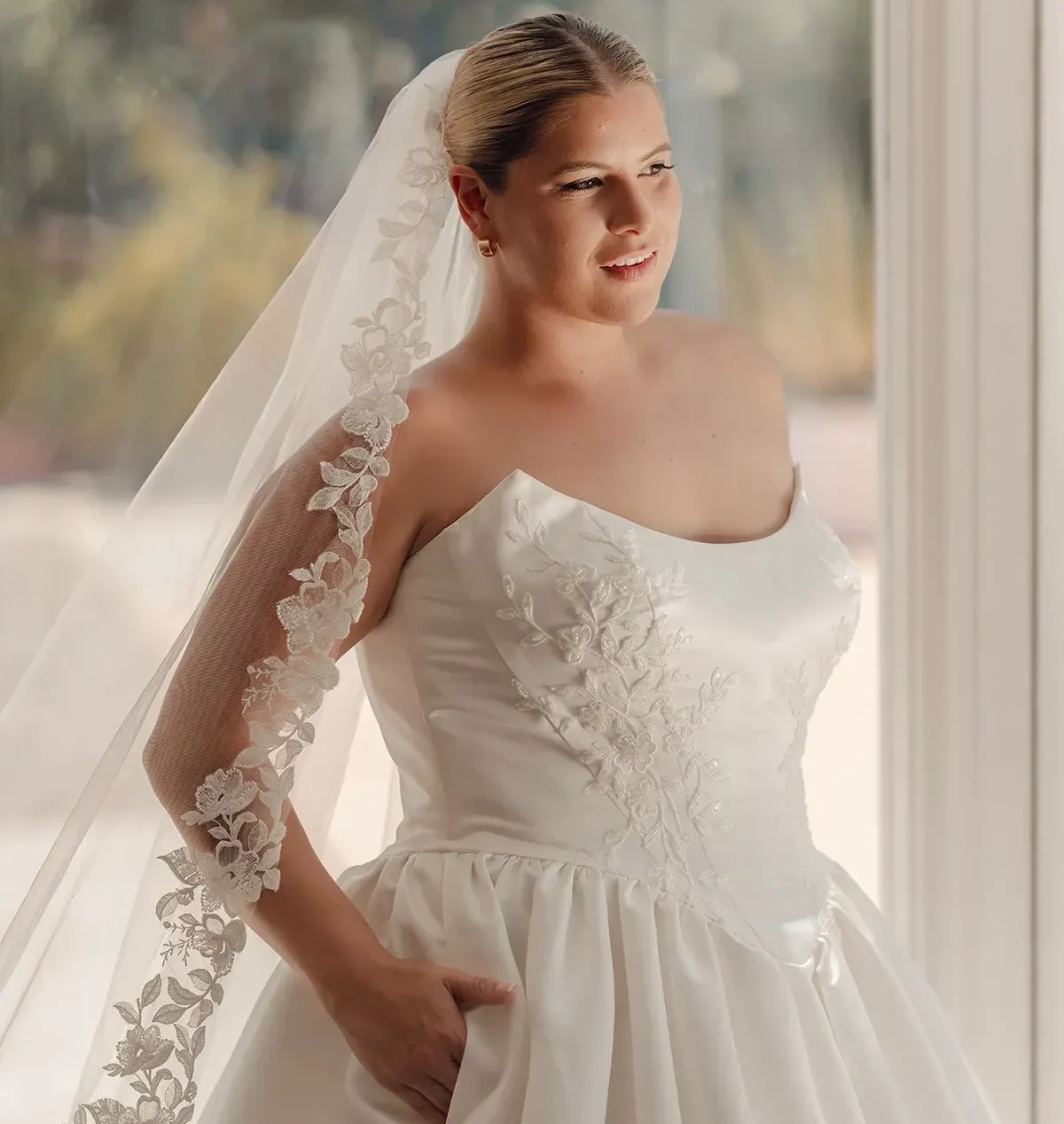 Model wearing a plus size gown